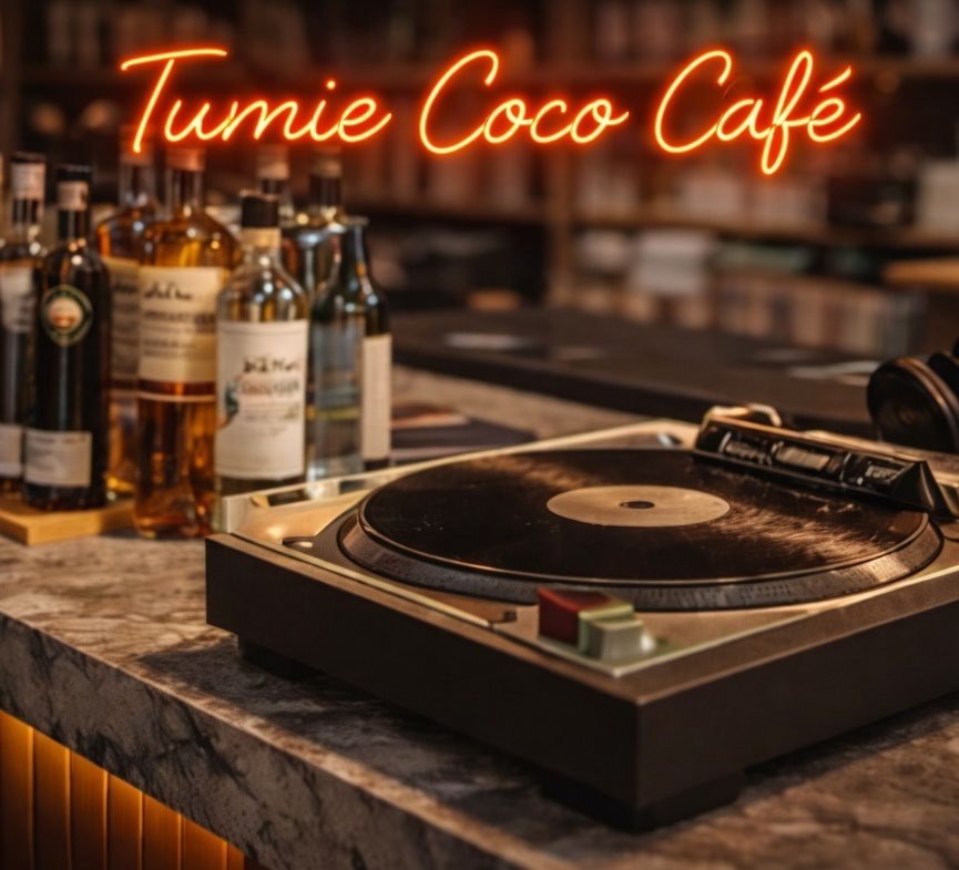A turntable on the bar under the Tumie Coco Café neon sign